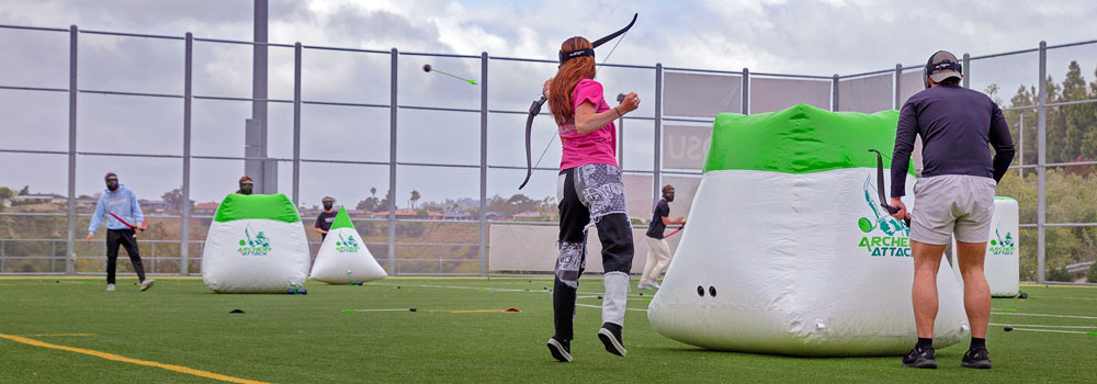 Archery game with objects to cover behind on a Rec Field
