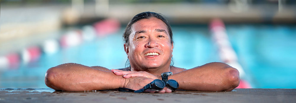Man smiling in Aquaplex Pool